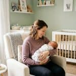 have a baby alone – single mother holding and feeding her newborn in a nursery