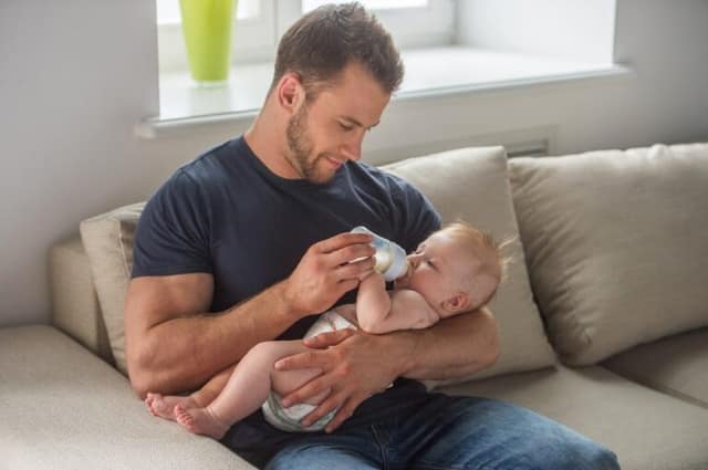 man baby young muscular feeding little