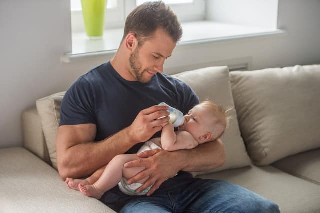 man baby young muscular feeding little