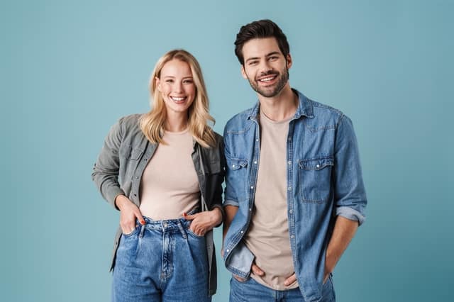 Healthy co-parenting smiling man and woman spending positive time together as co-parents