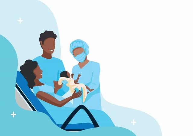 giving birth in hospital with medical team assisting mother and newborn