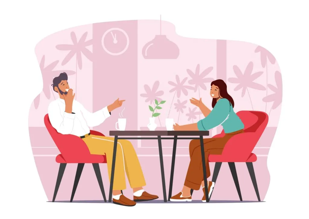 co parenting dating – man and woman talking at a table in a relaxed café setting