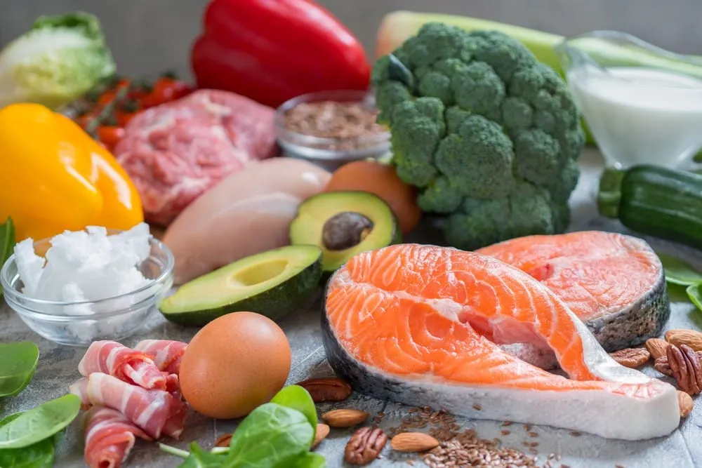 foods to get pregnant – healthy fertility foods including salmon, avocado, eggs, vegetables, and nuts